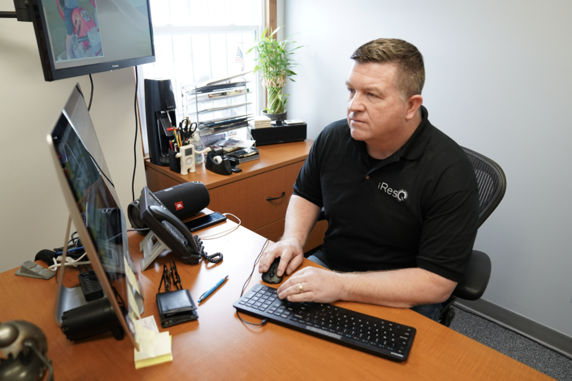 iresQ employee working at desk